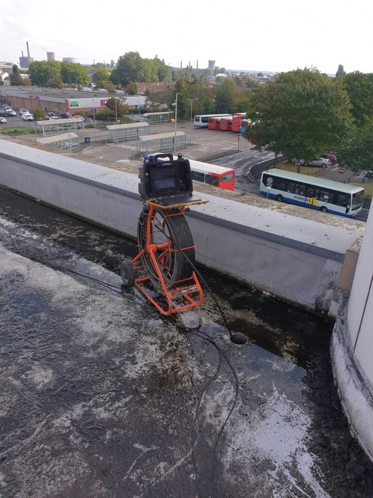 Equipment Unblocking Drains on Roof