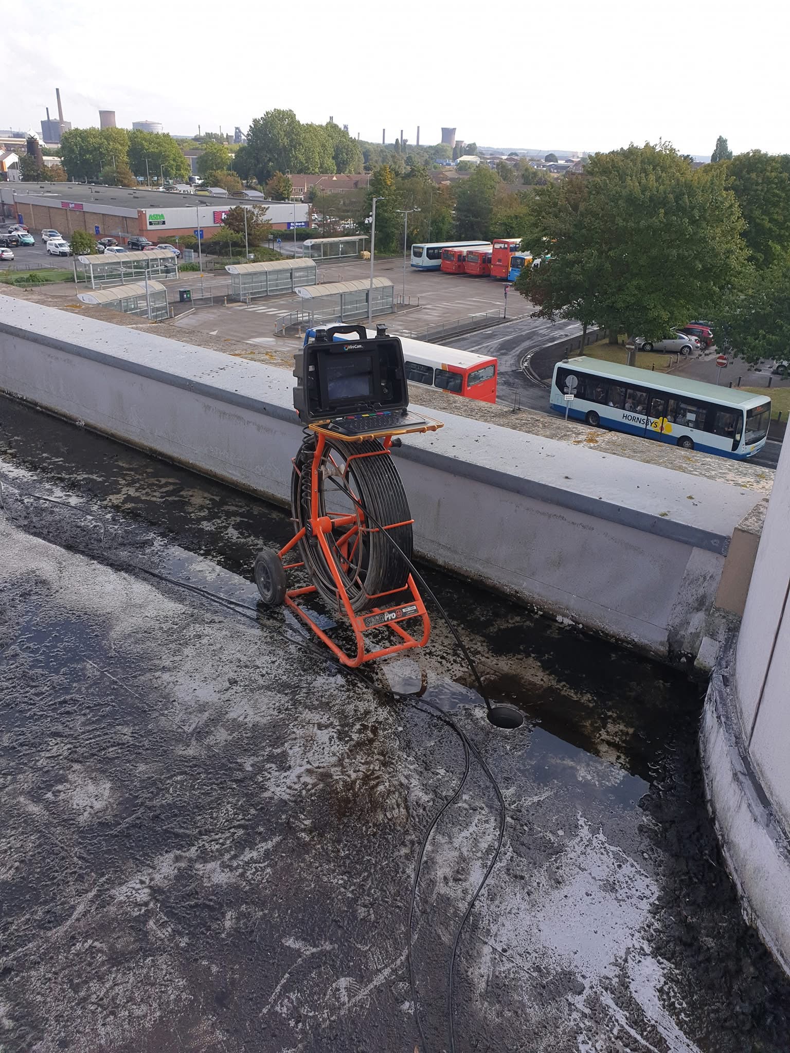 Equipment Unblocking Drains on Roof